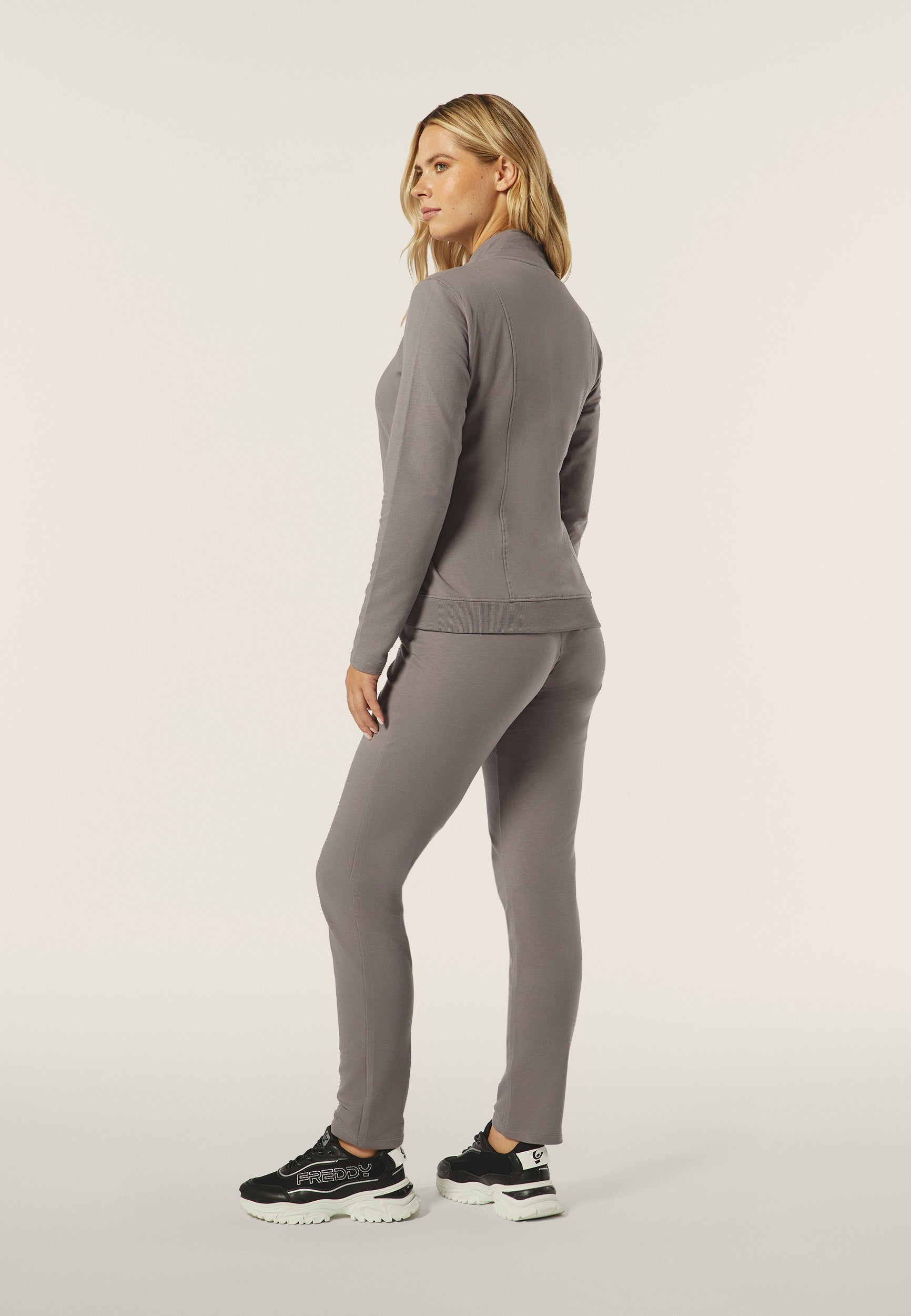 Women's track suit in fleece with a zip, high neck and bead