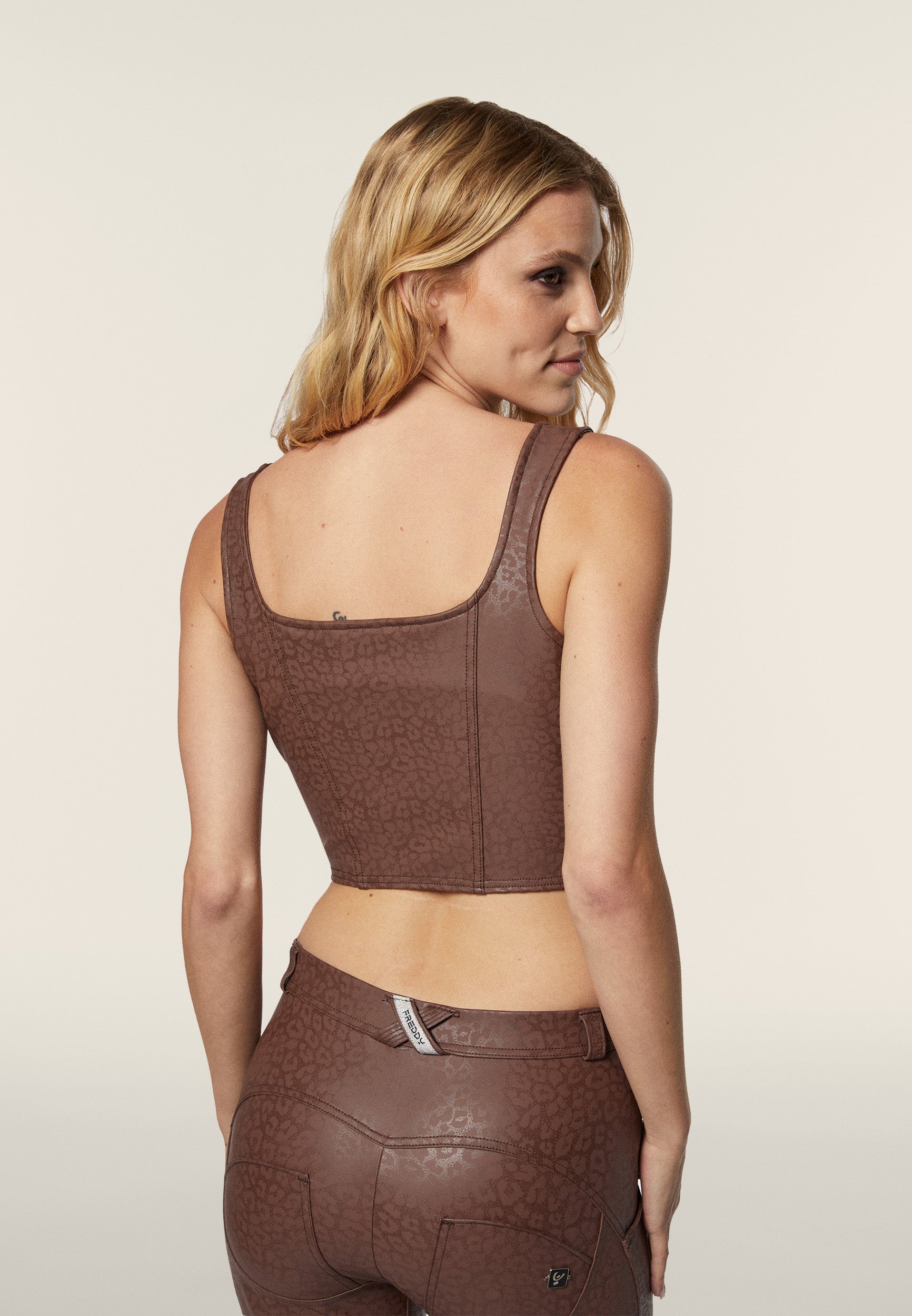 Cropped bustier top in shiny animal print faux leather