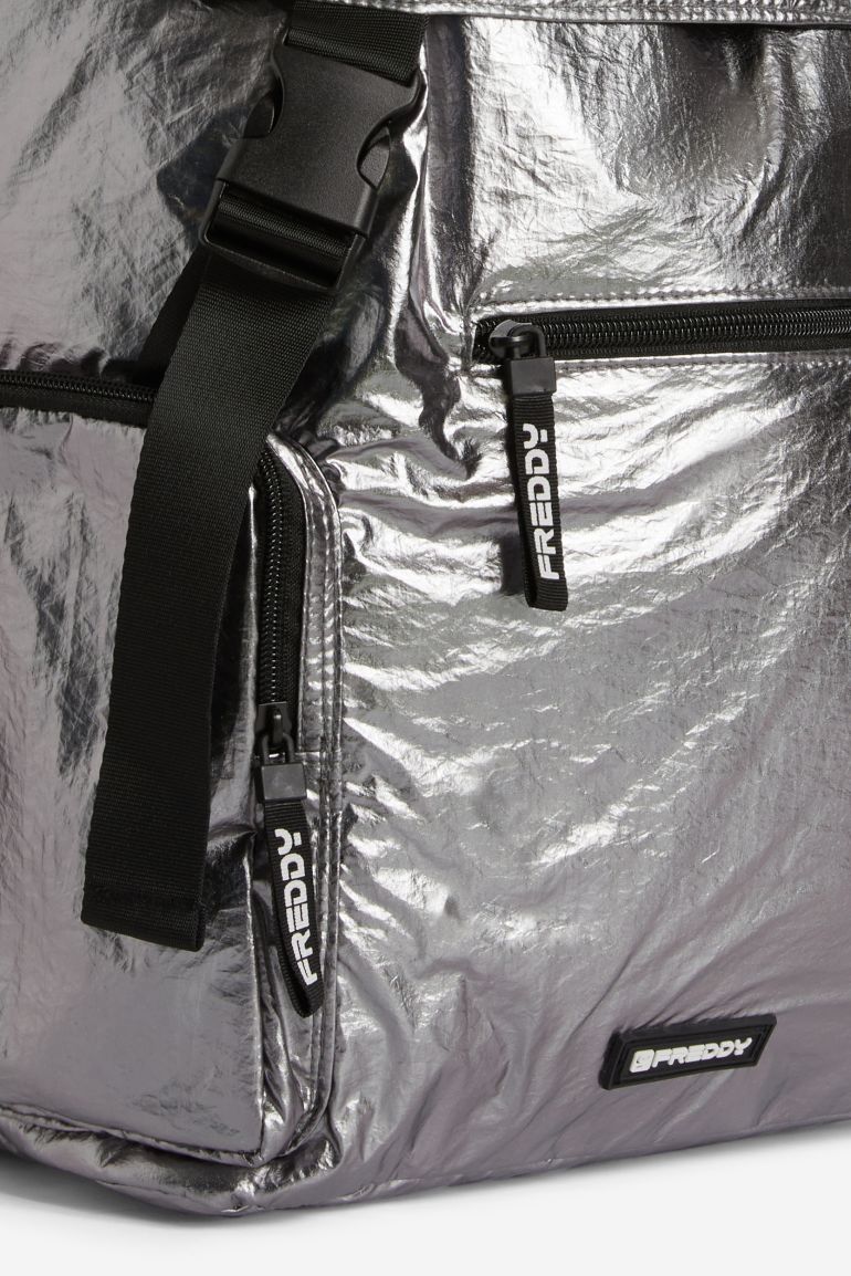 Metallic backpack with a buckle closure and side pockets