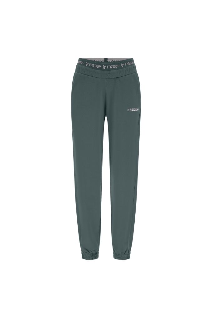 Pantaloni sportivi in felpa garzata con elastico logato 