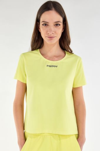 T-shirt, cut short, in lightly fluorescent jersey with small black logo