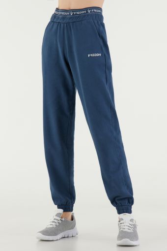 Pantaloni sportivi in felpa garzata con elastico logato 