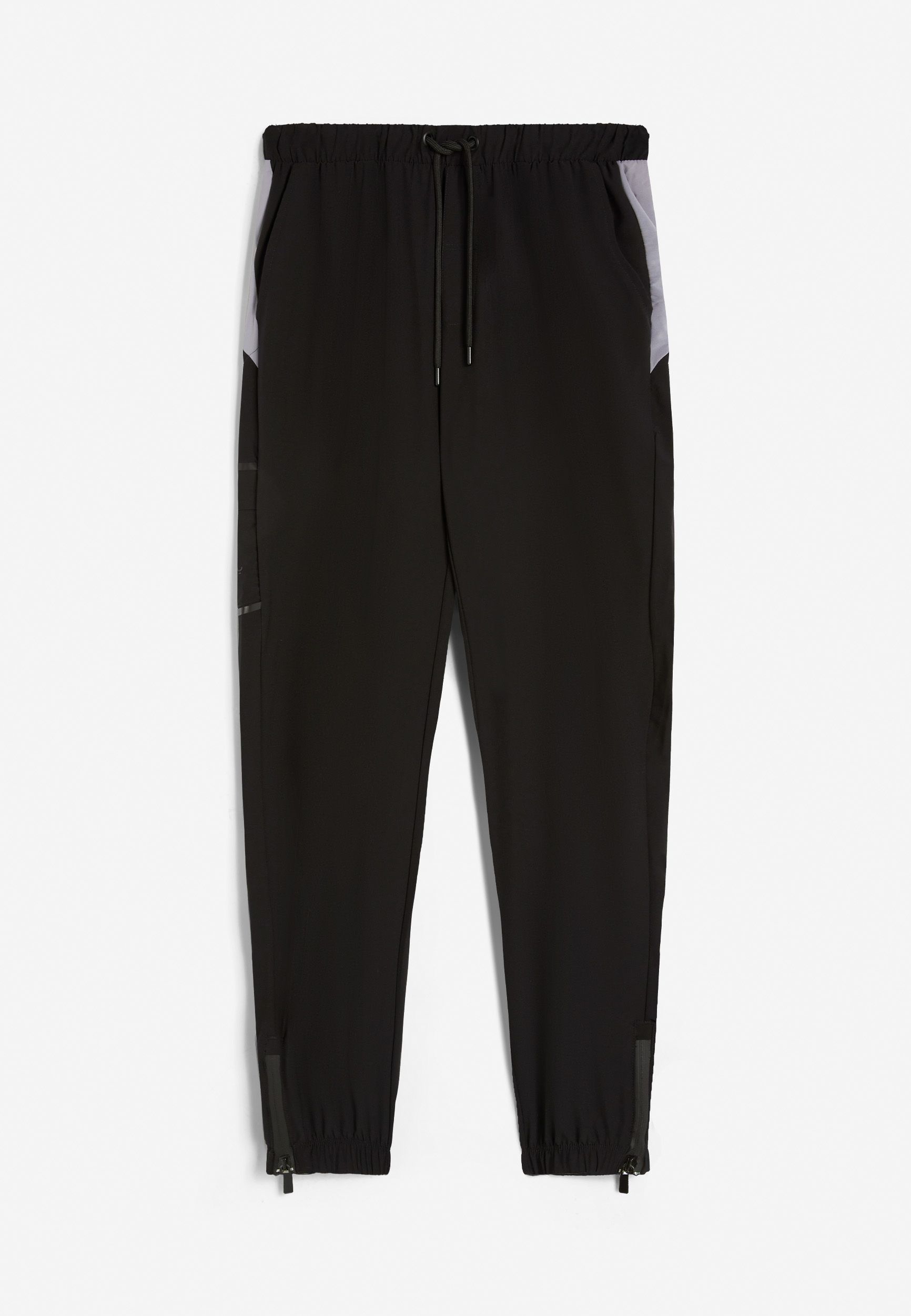 Men's trousers in polyester fabric with zip at the ankles